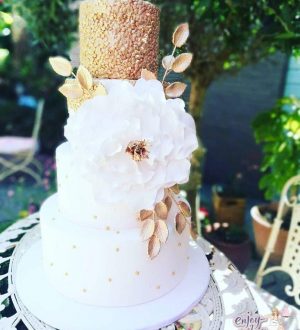 White wedding cake with gold