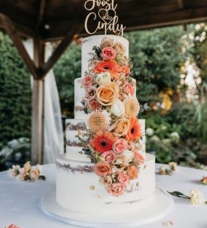 Semi naked cake with waterfall of flowers