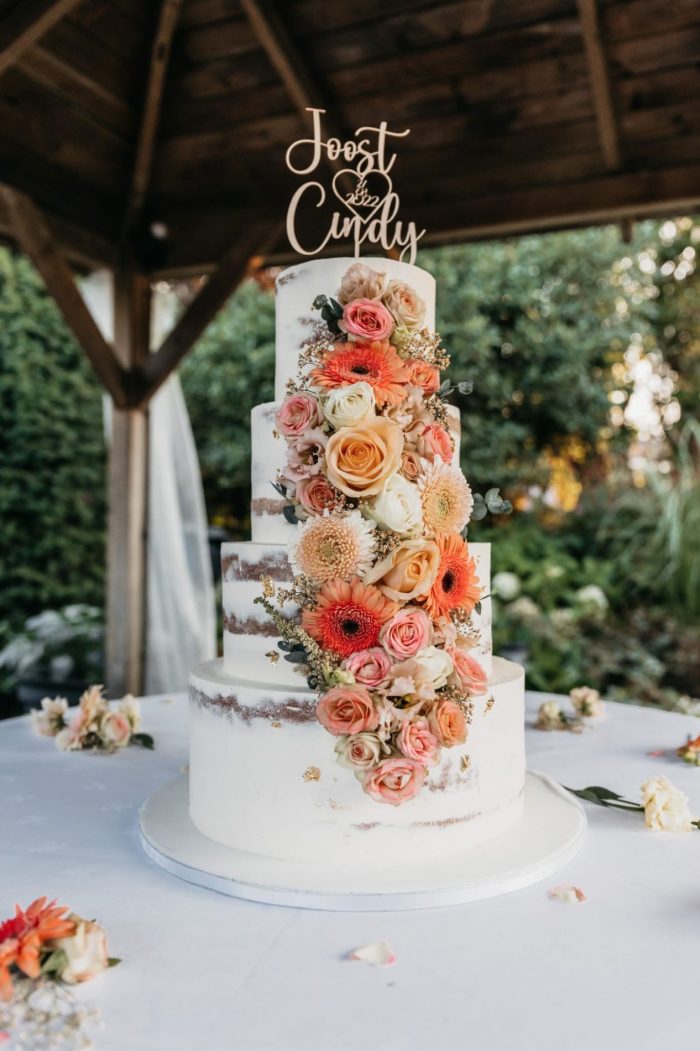 Semi naked cake with waterfall of flowers