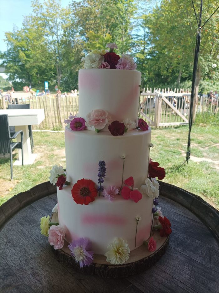 Fondant cake with pink airbrush and edible flowers