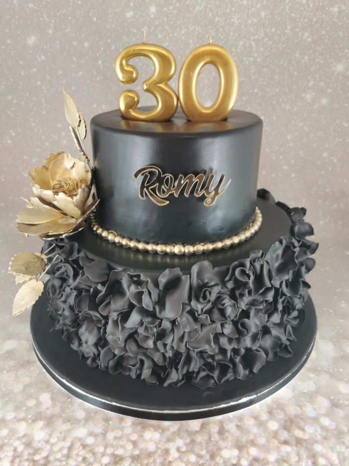 Black and gold ruffle cake