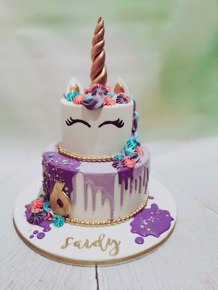 Unicorn cake with purple dripp