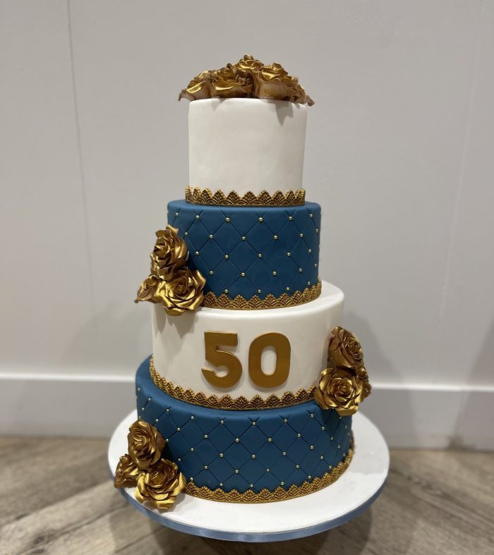 Navy blue & gold roses cake